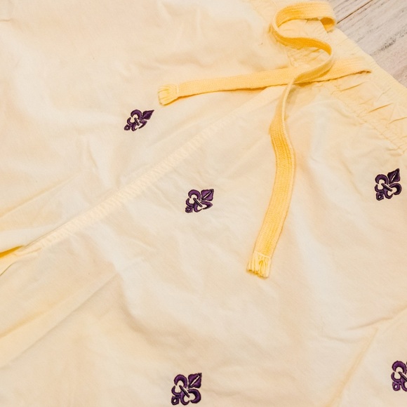 Castaway Soft Yellow Shorts with Purple Fleur De Lis details - Picture 2 of 4